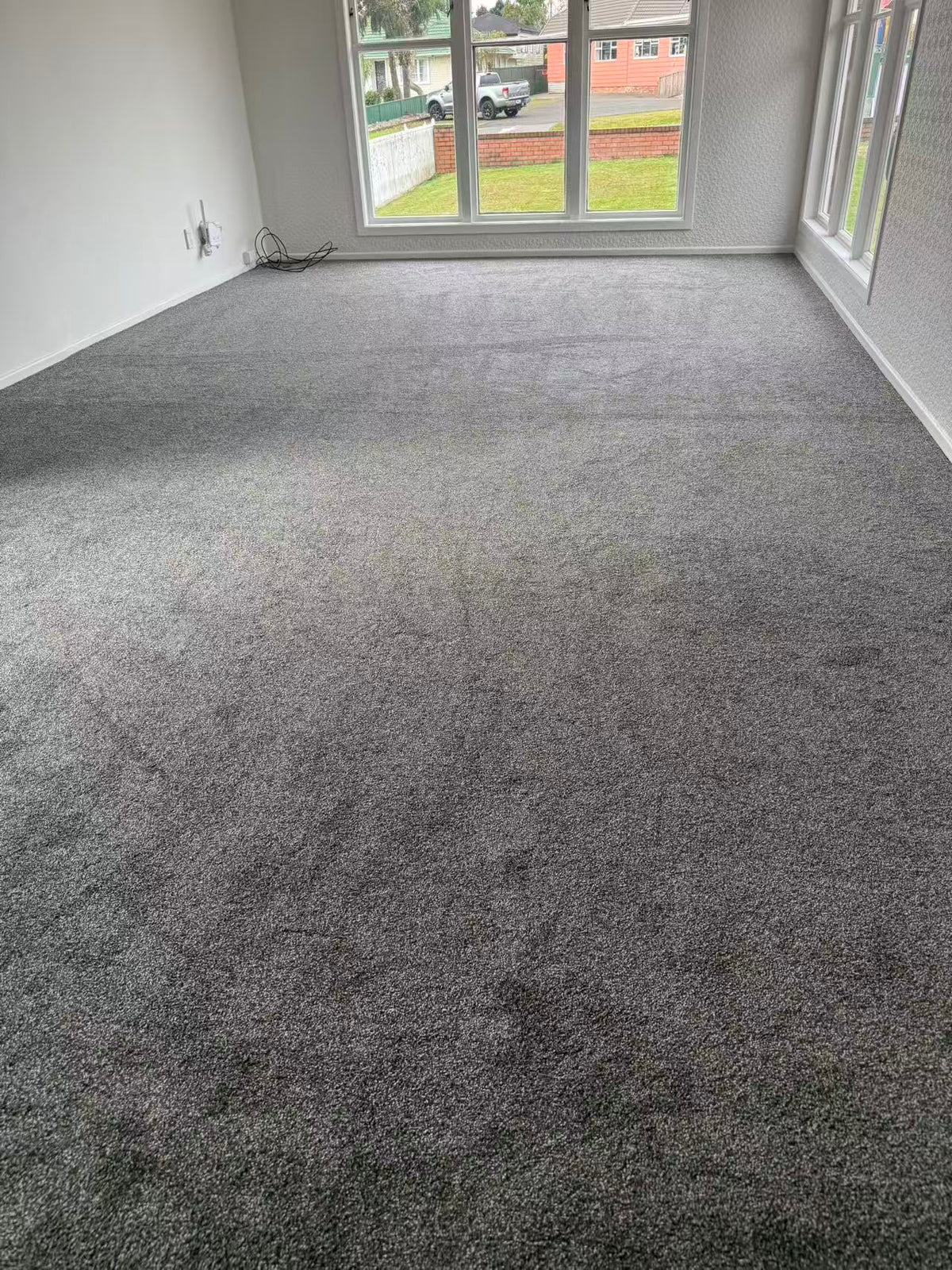 Completed West Auckland carpet replacement in a renovated Henderson living room
